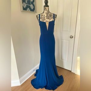 Halston gown. Blue with v neck detail.